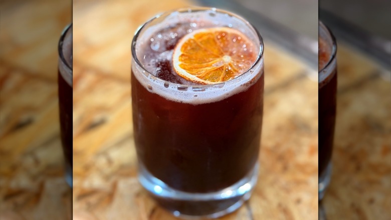 glass of iced coffee with orange slice