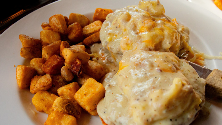 Breakfast biscuits with gravy and home fries