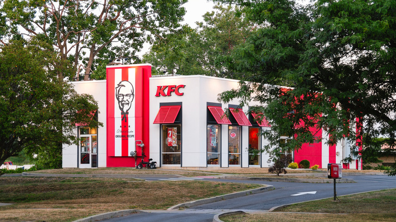 KFC storefront and trees on sunny day