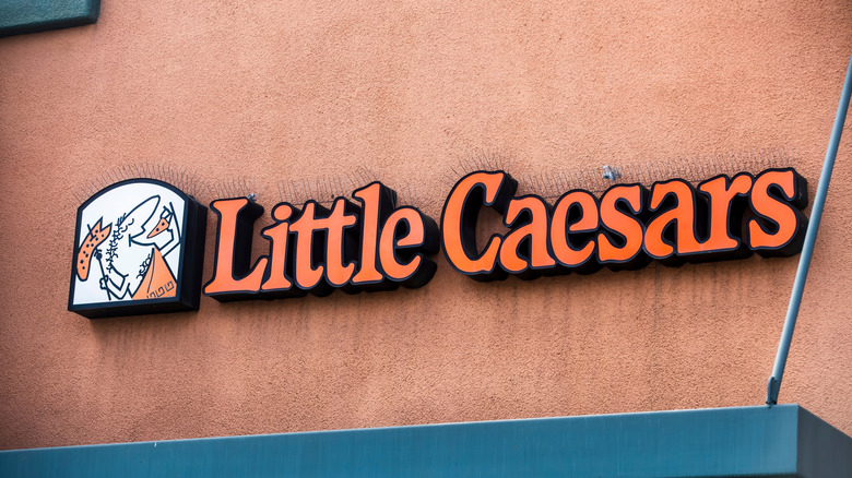 Little Caesars orange sign above storefront