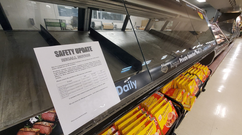 Empty deli case with recall notice