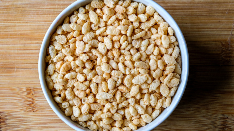 rice ceral in white bowl on wooden table