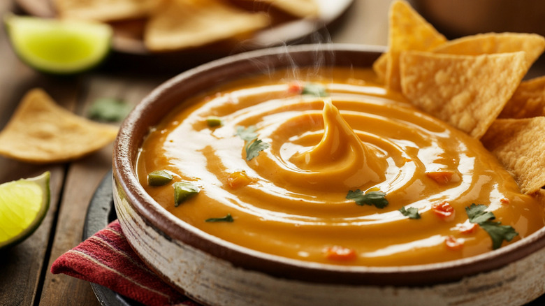 queso in a bowl with chips
