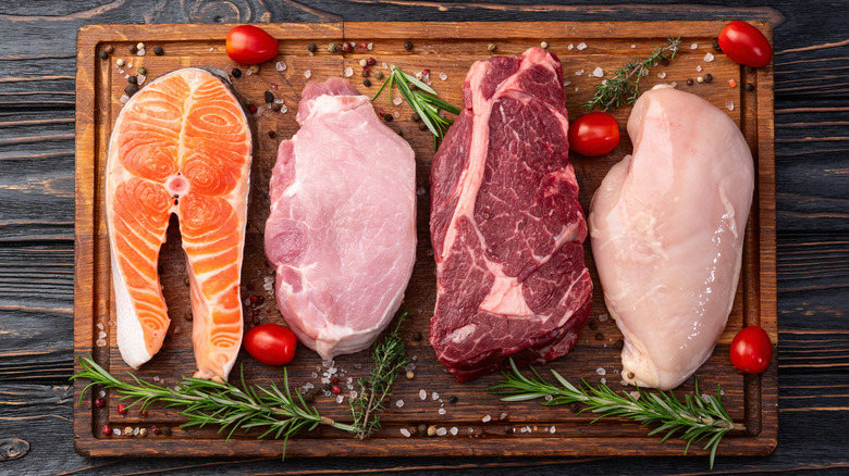 Raw salmon, pork, beef, and chicken