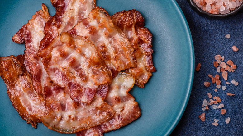 Plate of bacon with pink sea salt