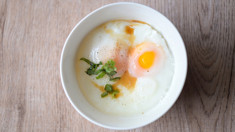 Egg in a white bowl with chives