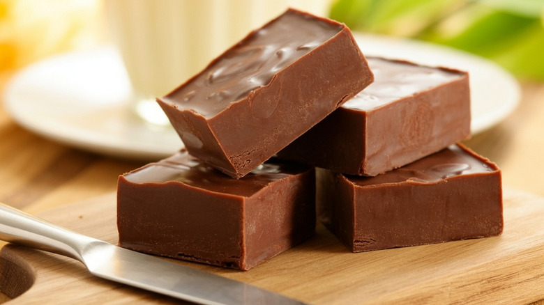 Squares of fudge with a knife