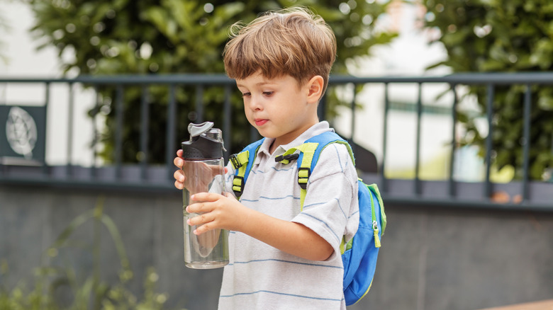 young boy with a water bottle