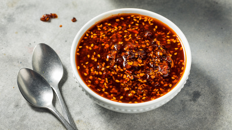 Bowl of chili crisp oil with two spoons