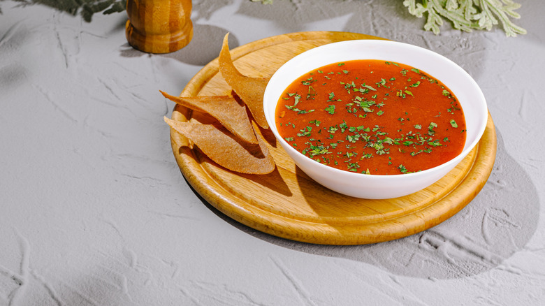 Tomato soup covered with herbs