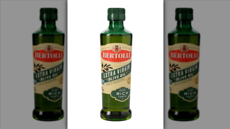 A bottle of Bertolli Extra Virgin Olive Oil on a white background