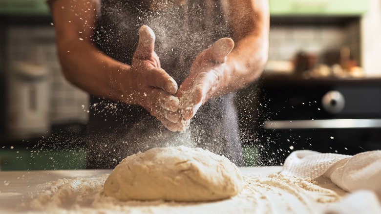 Hands kneading dough
