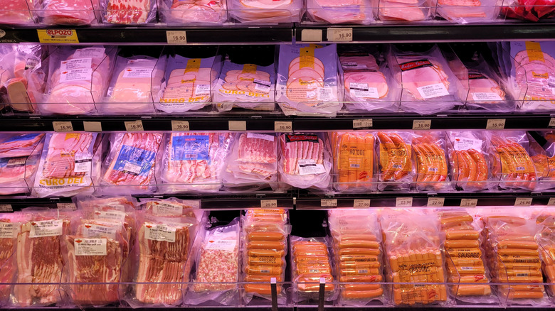 Packages of processed ham in grocery store cooler