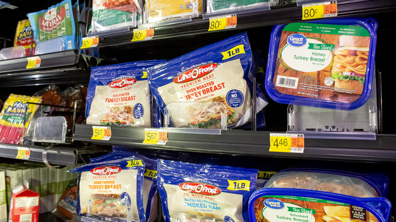 Packages of Land O' Frost ham and turkey in refrigerated aisle