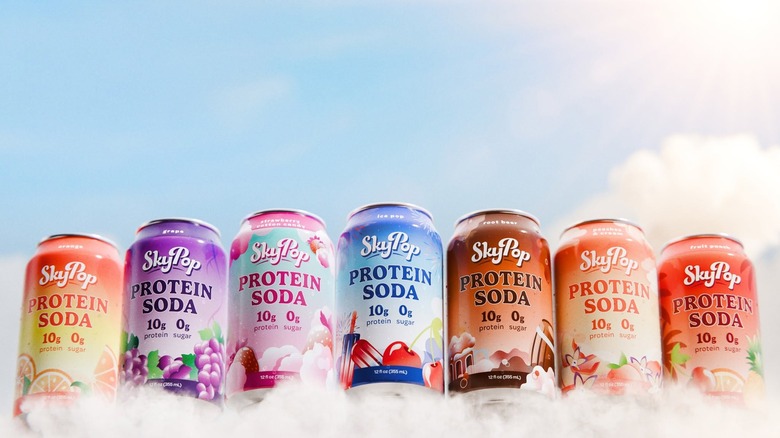 Cans of SkyPop against blue sky