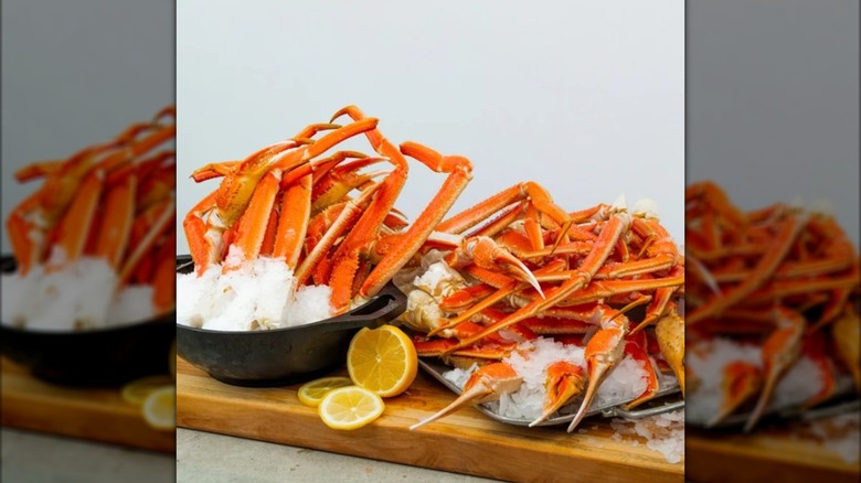 Crab legs on ice and a cut lemon