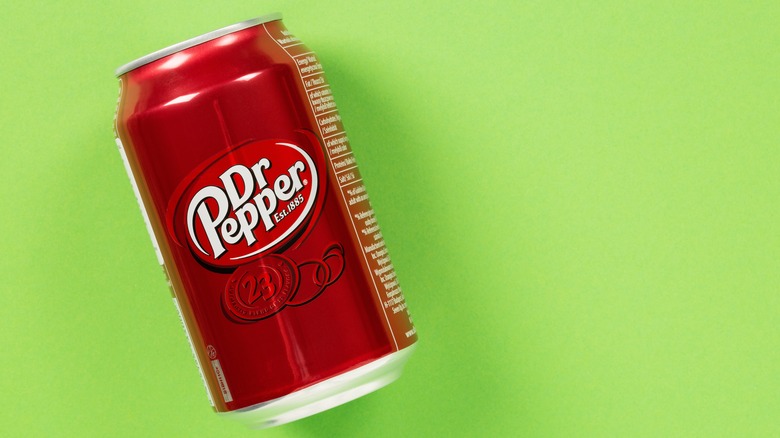 Can of Dr Pepper on green background