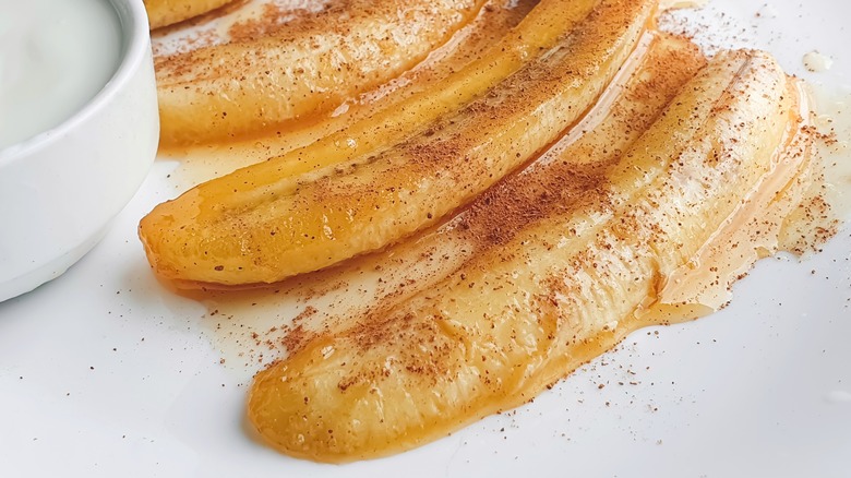 Caramelized bananas on plate with cinnamon
