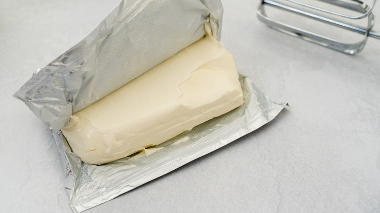 Unwrapped brick of cream cheese