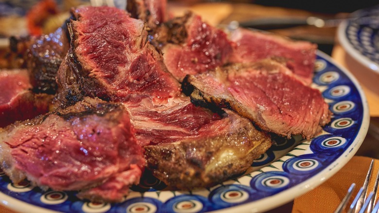 Closeup of a cut Florentine porterhouse steak, bistecca alla Fiorentina