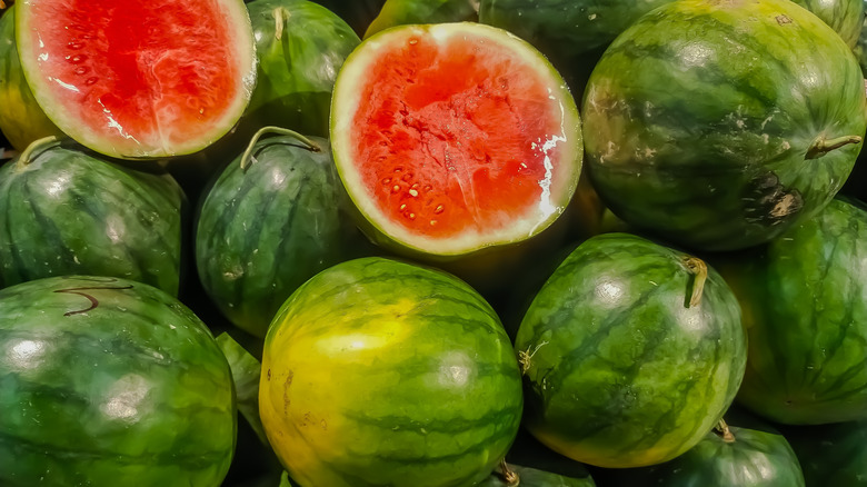 Pile of shiny watermelons in store