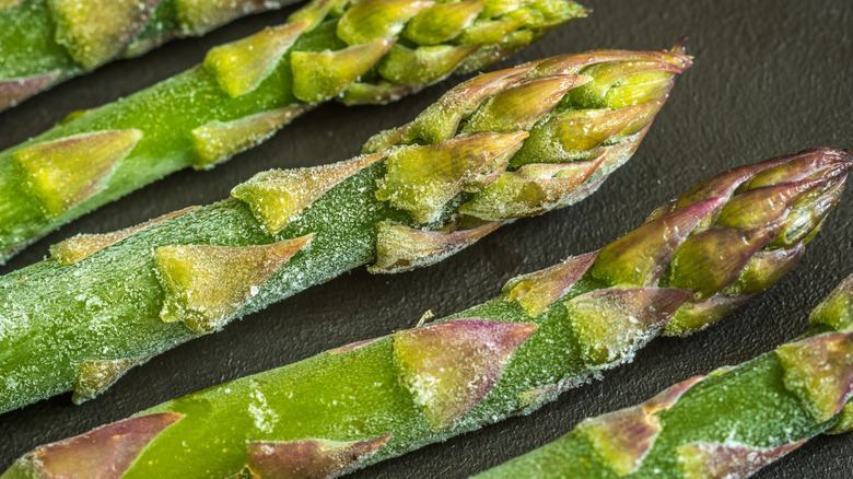 Stalks of frozen asparagus