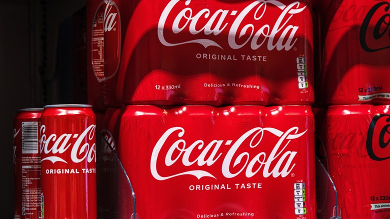 Packs of Coca Cola soda cans