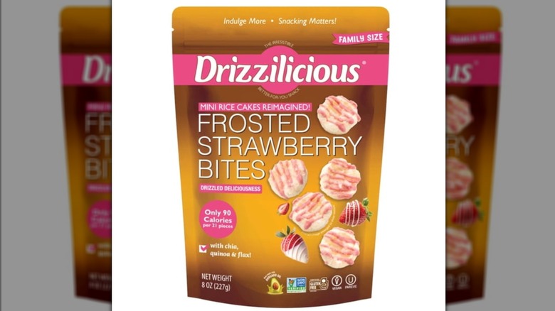 A bag of Drizzilicious Mini Rice Cake Bites in Frosted Strawberry flavor isolated on a white background