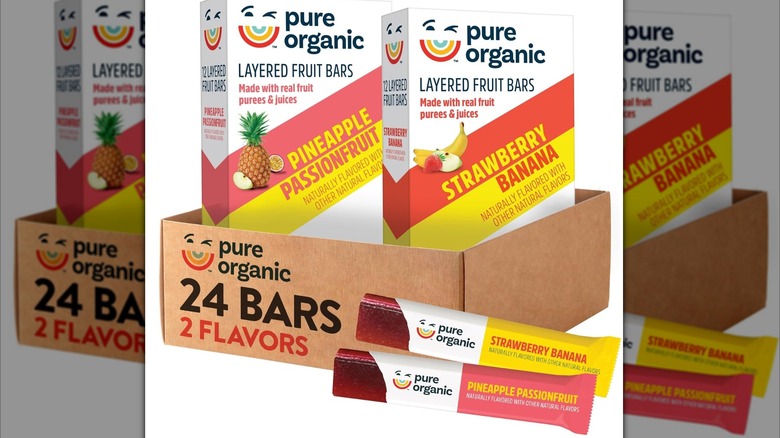 Boxes of Pure Organic Layered Fruit Bars with individual bars partially unwrapped in the foreground
