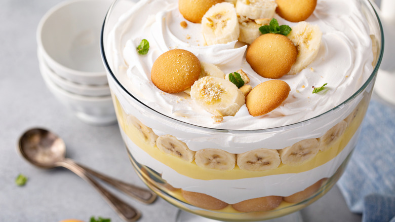 Banana pudding with bowls and spoons