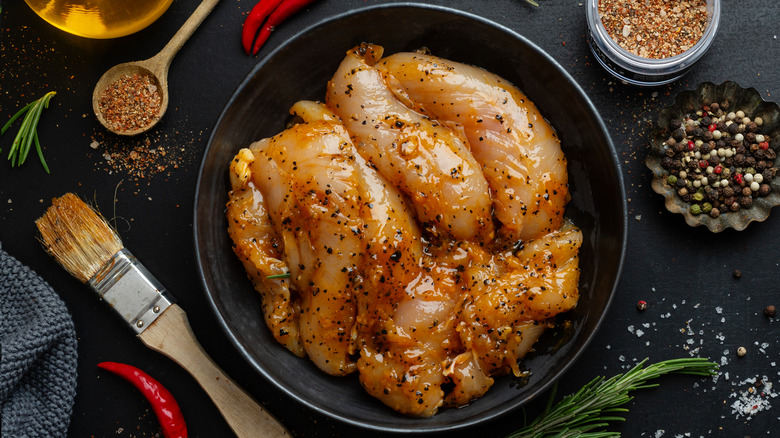 Raw chicken breast in marinade