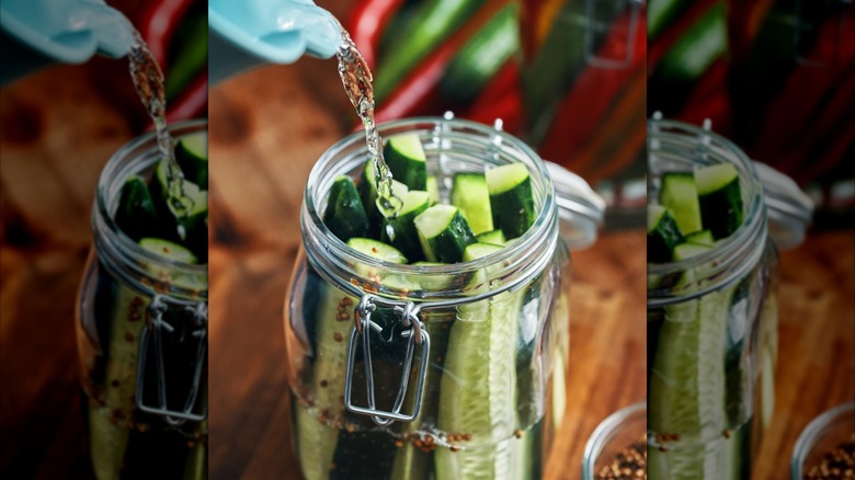Making pickles in a jar with raw cucumbers