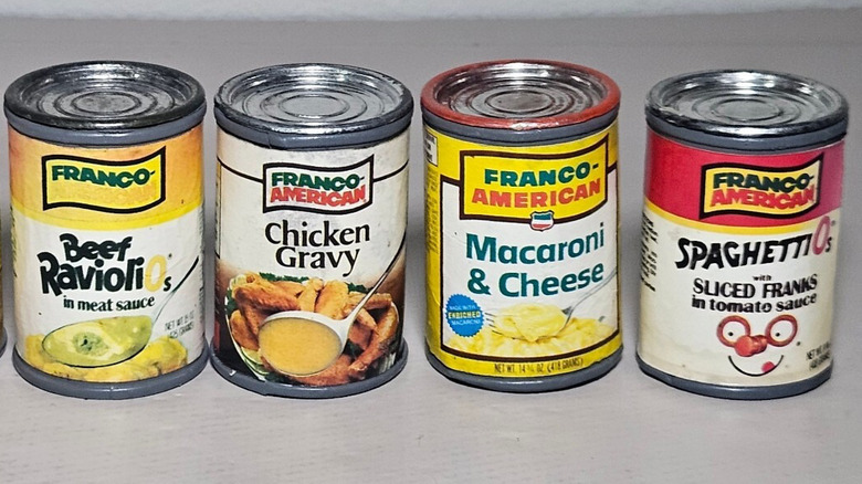 Four Franco-American cans of pasta products and gravy