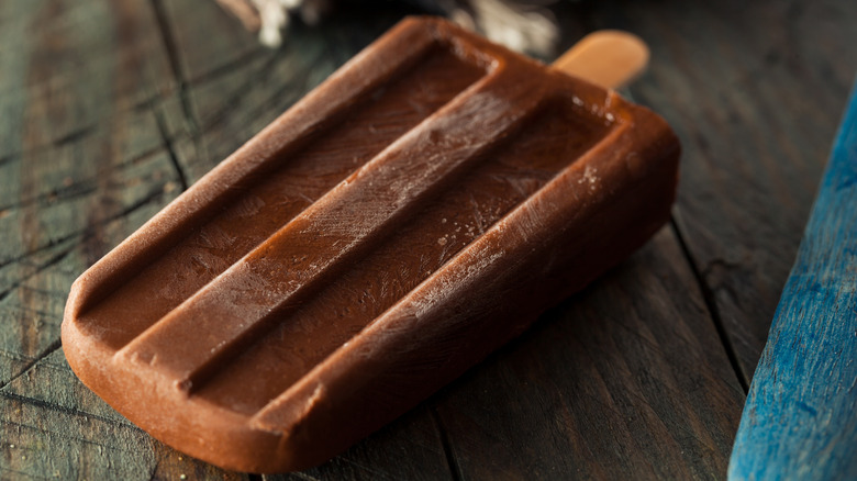 Close-up of unwrapped Fudgesicle chocolate popsicle