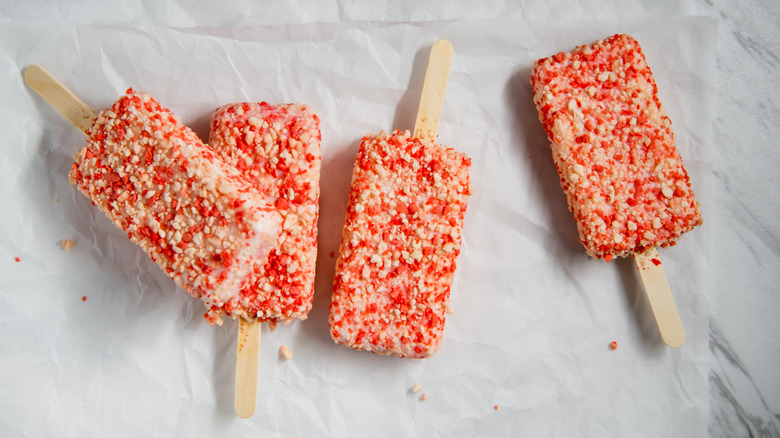 Four unwrapped Good Humor Strawberry Shortcake ice cream bars