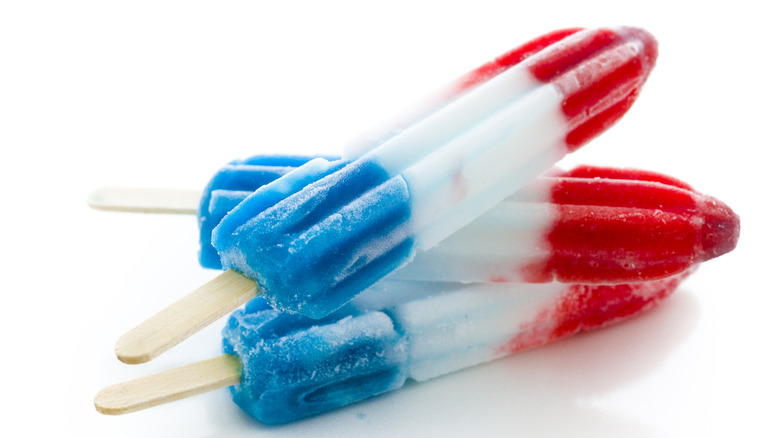 Three Bomb Pops popsicles laying on top of each other