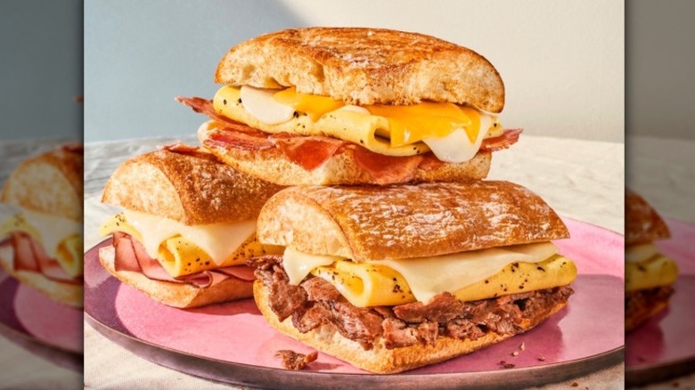 Three Panera breakfast sandwiches stacked