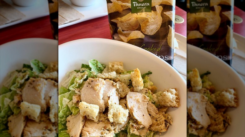 a bowl of Panera Caesar salad with croutons and chicken