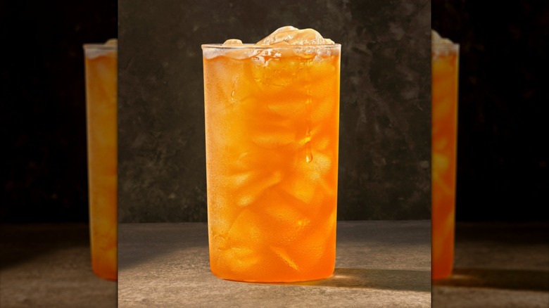 a large cup of orange citrus punch