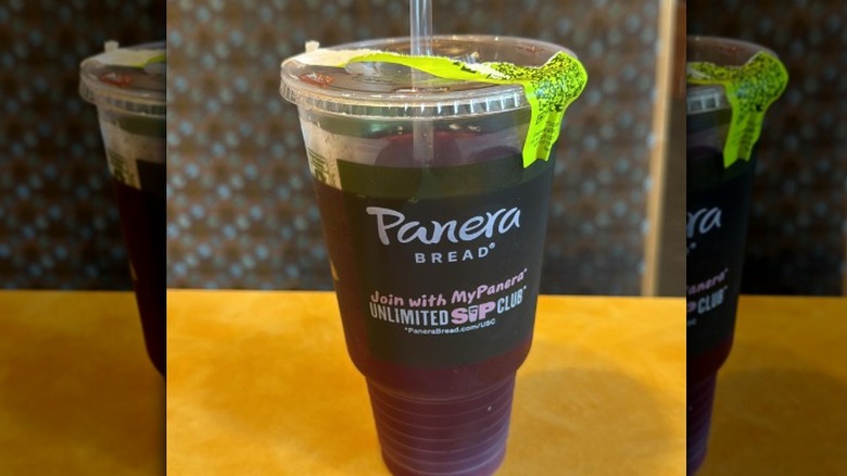 purple-colored pomegranate hibiscus tea in to-go cup