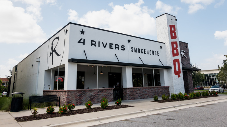 The exterior of a 4 Rivers Smokehouse restaurant
