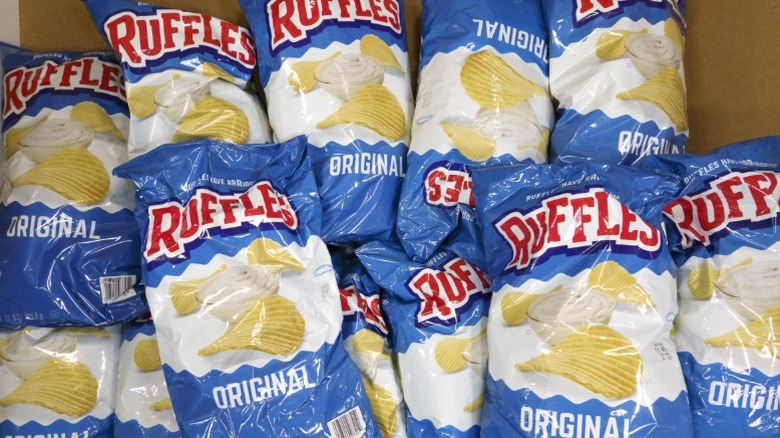 Bags of Ruffles potato chips for sale.