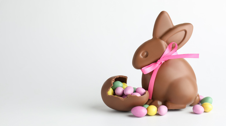A chocolate bunny with Easter candy in a chocolate egg