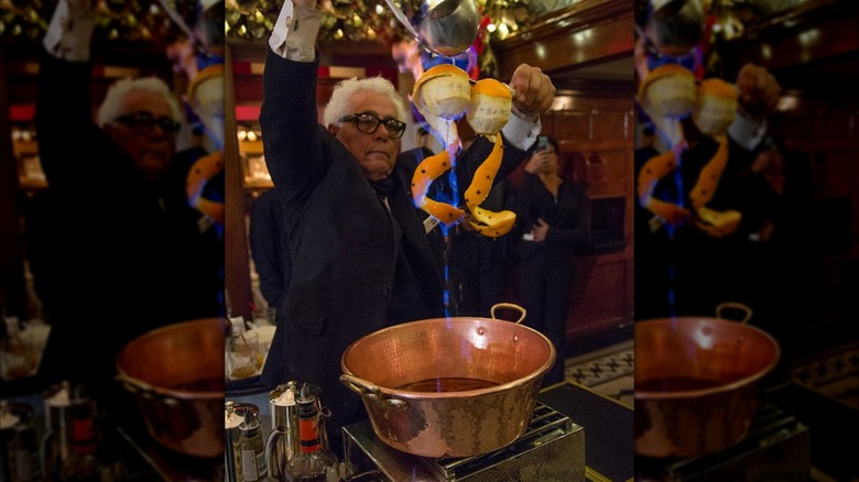 Man making the cafe brulot at Arnaud's & the French 75 Bar