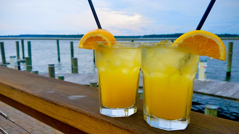 Orange crush cocktails by the water