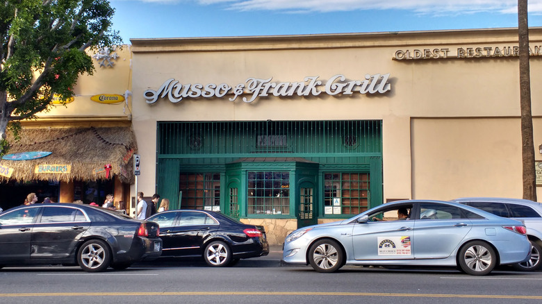 Cars passing by Musso & Frank Grill