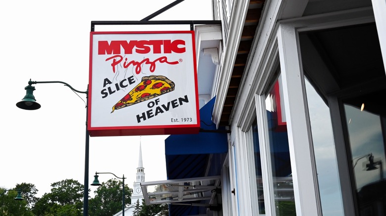 Sign for Mystic Pizza outside the restaurant