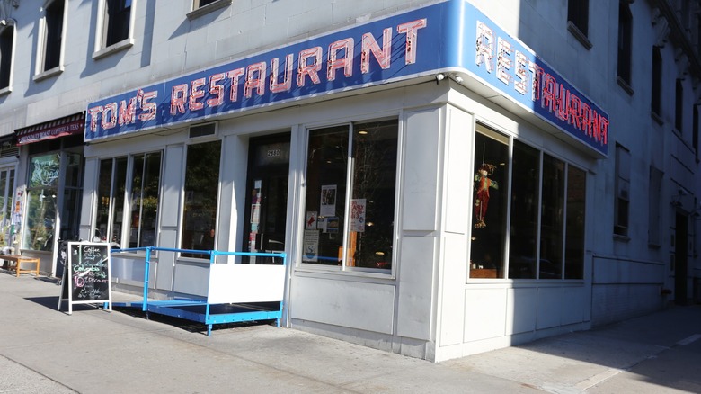 Exterior of Tom's Restaurant with neon sign
