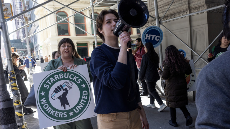 Person on a bullhorn at a Starbucks workers' rally