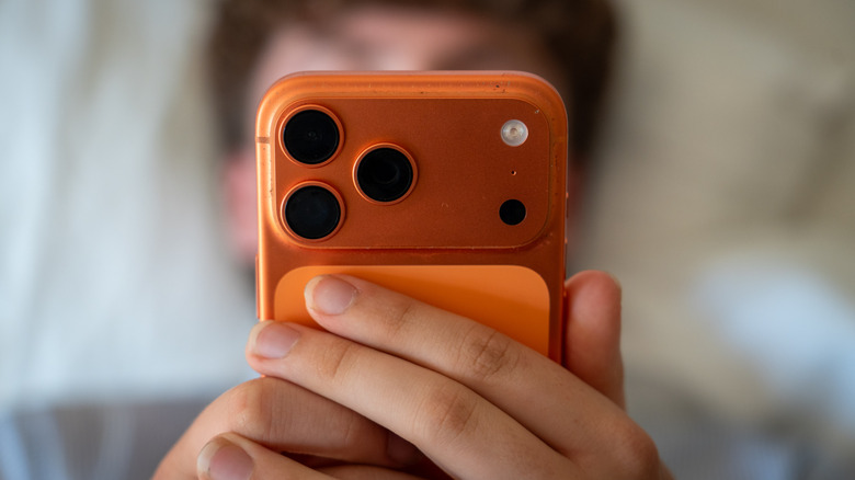 A close up of a person using their phone
